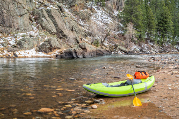istock inflatable whitewater kayak on a rocky shore of a mountain river 1143282974