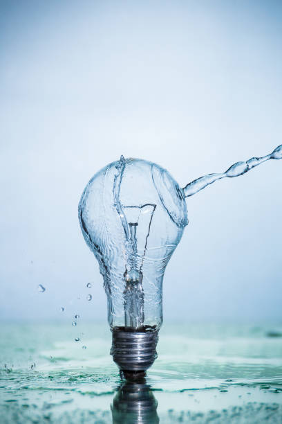 istock Bulb lamp with motion freezed water splashes. 1143283286