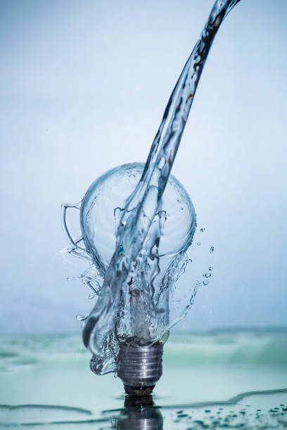 istock Bulb lamp with motion freezed water splashes. 1143284342