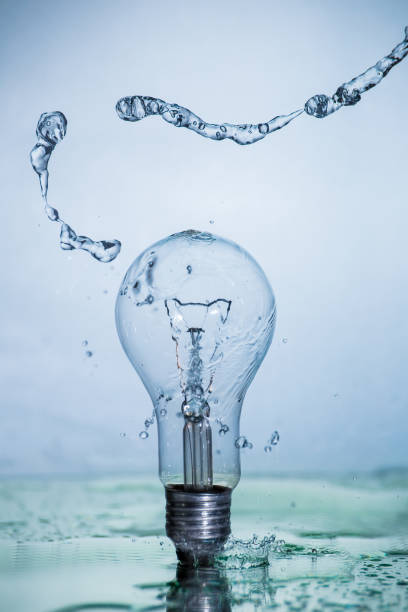 istock Bulb lamp with motion freezed water splashes. 1143284550