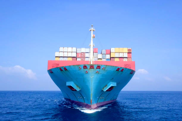 istock Large container ship at sea - Low angle aerial image. 1143284922