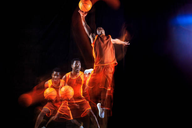 istock Young basketball player against dark background 1143285931