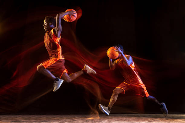 istock Young basketball player against dark background 1143285986