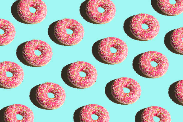 istock Donuts on a bright color background. Bright collage 1143286339