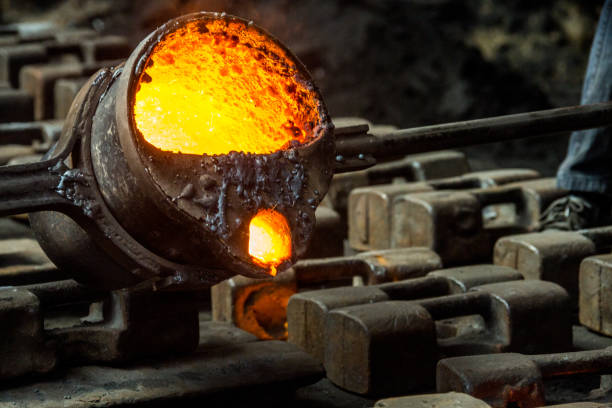 istock metal casting process with red high temperature fire in metal part factory 1143286521