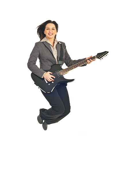 istock Executive woman jumping with guitar 114328660