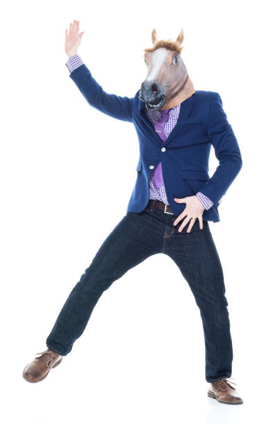 istock Businessman with horse mask is dancing 1143287808