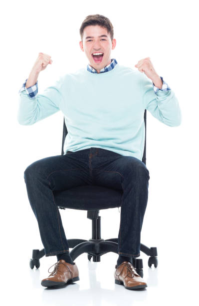 istock Handsome young man sitting and feeling excited 1143288066