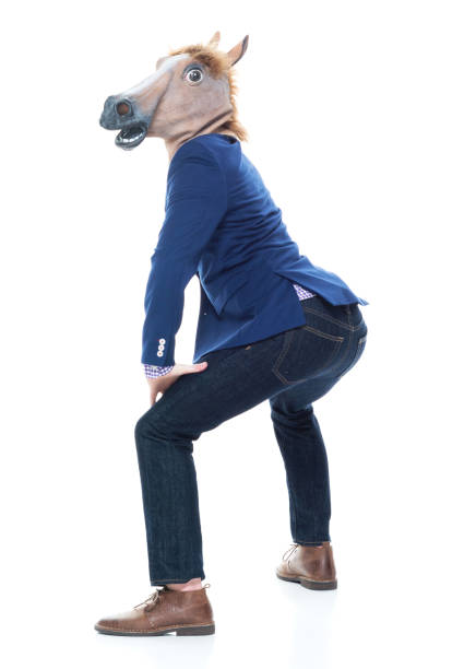 Businessman with horse mask is dancing