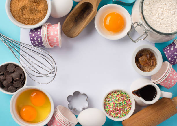 istock Ingredients and utensils for baking, blue background 1143288379