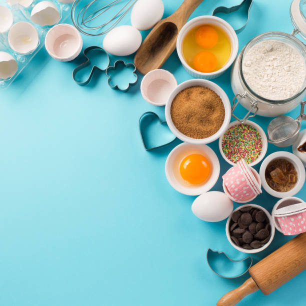 istock Ingredients and utensils for baking, blue background 1143288398