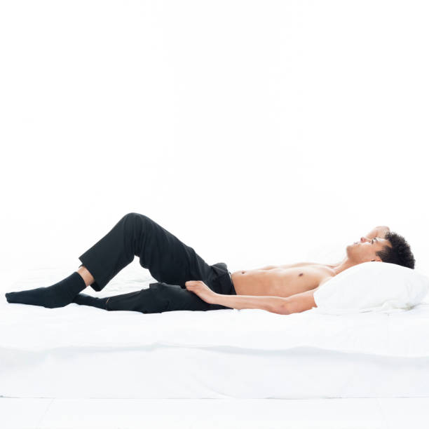 istock Sexy shirtless man in bed 1143289766