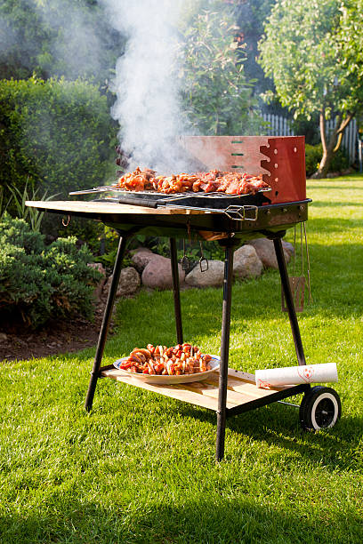 Charcoal burning under a grill at a barbecue.