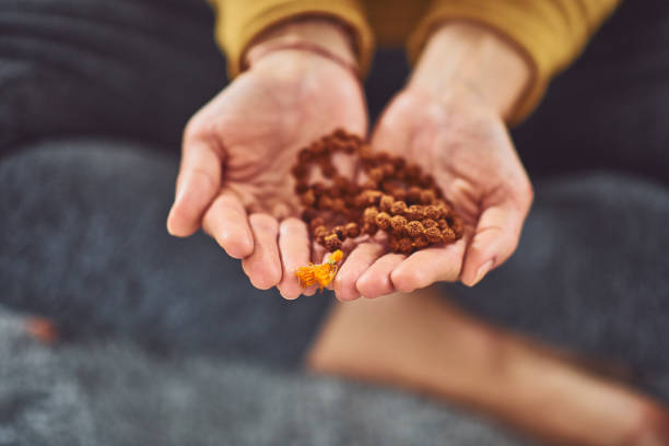 Woman holding praying beads.