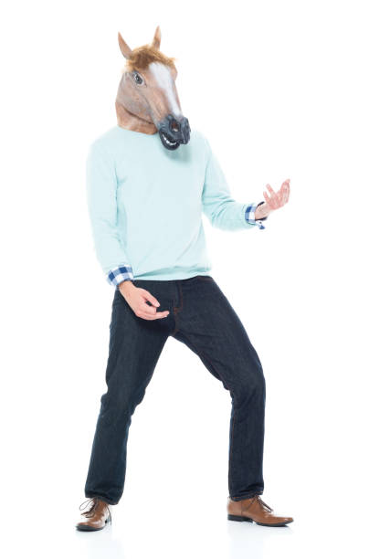 istock Man with horse mask doing air guitar 1143292928