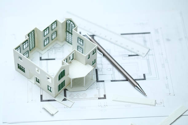 istock house model,blueprint,pencil and ruler on clean white background 1143293017