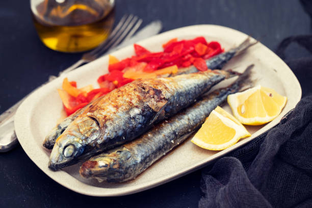 istock grilled sardines with red pepper and lemon on dish 1143293253