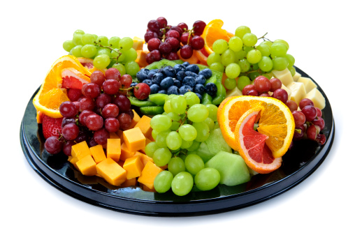 Isolated platter of assorted fruit and cheese