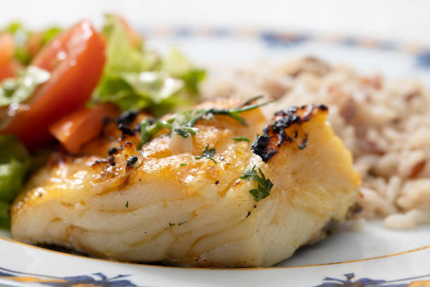 grilled cod fish with rice - bacalhau imagens e fotografias de stock