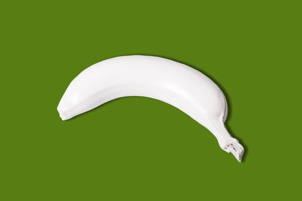 istock top view of white colored banana isolated on green background 1143295821