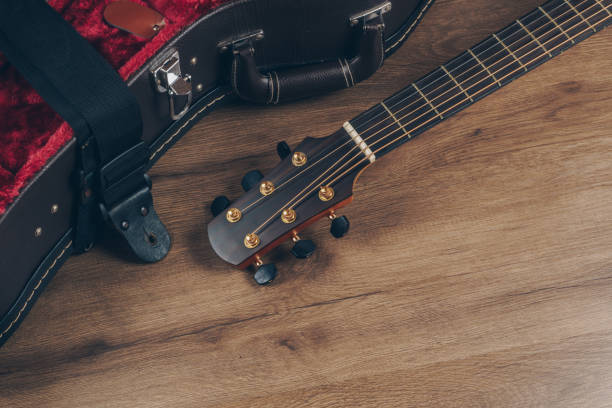 istock an acoustic guitar and leather guitar hard case 1143296915