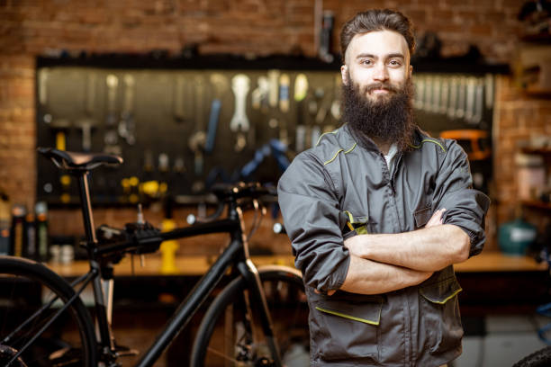 istock Repairman at the bicycle workshop 1143297344