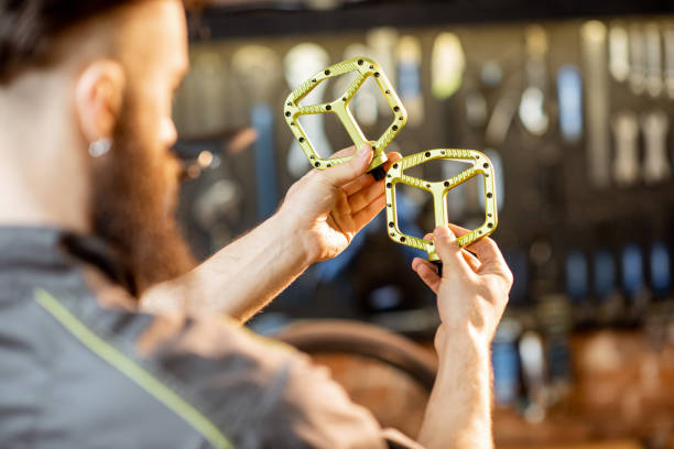 istock Repairman with bicycle pedals 1143297698