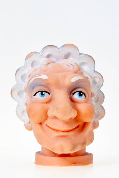 istock Vintage finger punch puppet, grandmother smiling, front view 1143297776