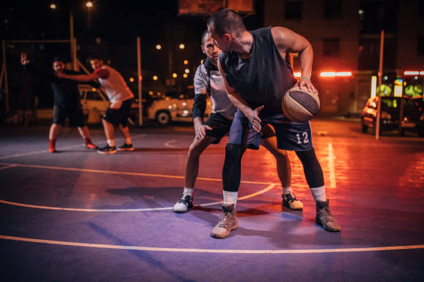 istock Friends playing basketball 1143300599