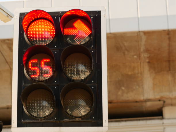 istock Old Red traffic light stand by weather and clock 1143300948