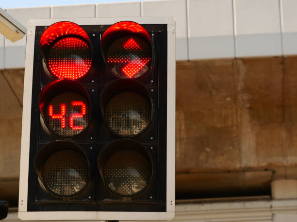 istock Red color of a traffic light on road 1143300950