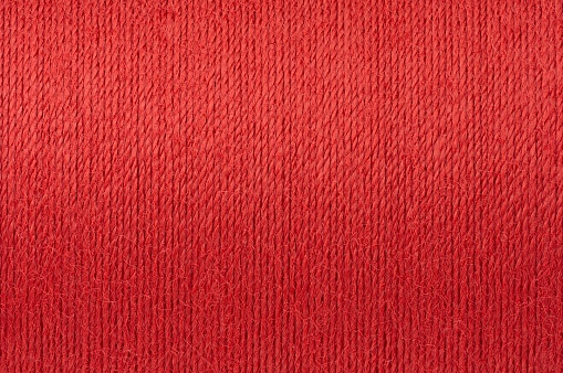 Red cloth waves texture background stage shot in table top for christmas background