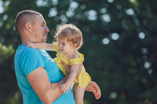 istock Father and his daughter enjoying in picnic 1143307198