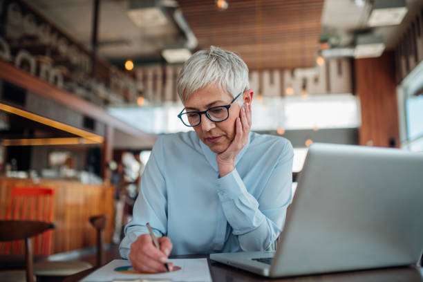 istock Business woman writing 1143307248