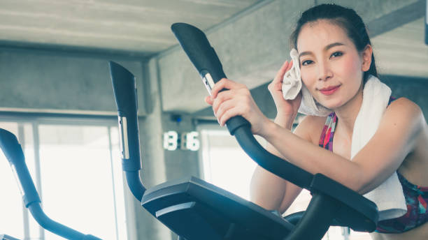 istock pretty girl exercise in gym 1143311509