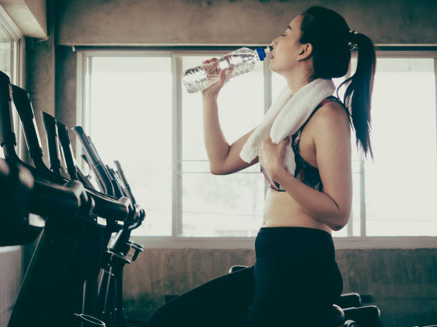 istock pretty girl exercise in gym 1143311540