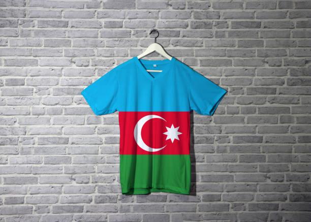 istock Azerbaijan flag on shirt and hanging on the wall with brick pattern wallpaper. 1143311600