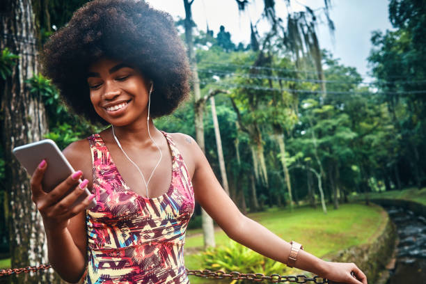 istock young woman taking a break from training and using her smartphone 1143314164