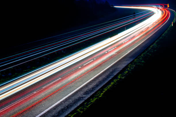 istock lights of cars with night 1143314486