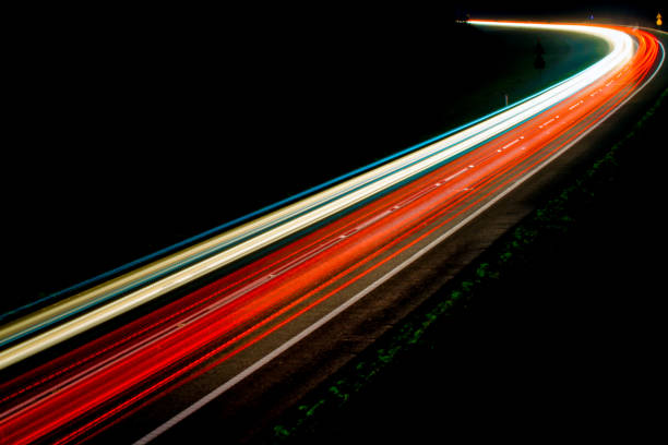 istock lights of cars with night 1143316014