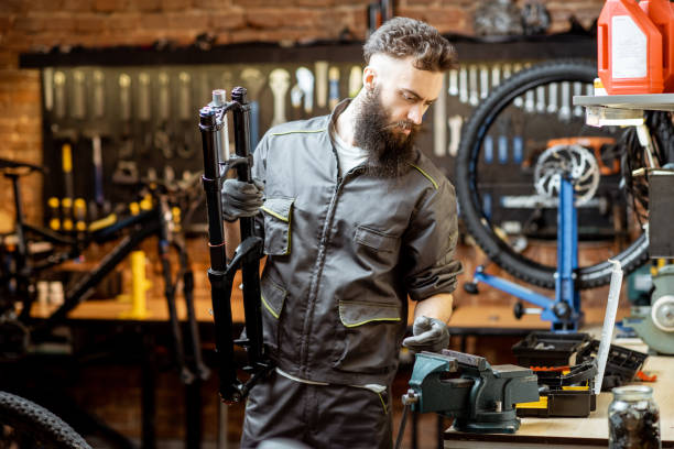 istock Repairman working in the bicycle workshop 1143316728