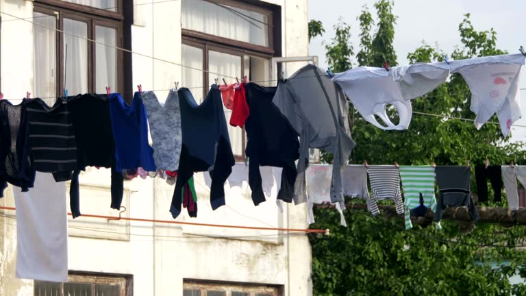 Clothes Weigh and Dry on a Rope in a Multi-Storey Building in a Poor Neighborhood of the City