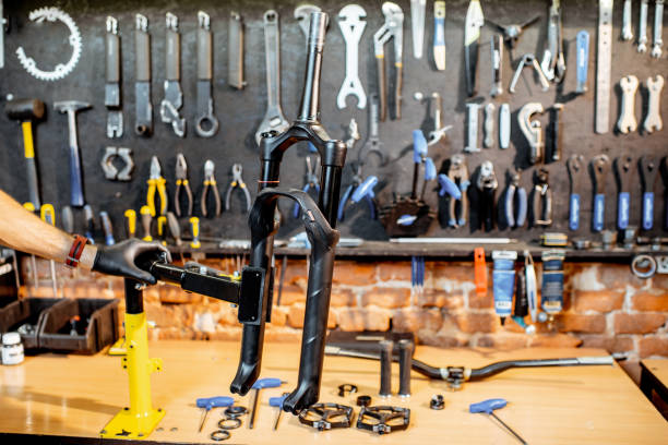 working place at the bicycle workshop - fork wrench imagens e fotografias de stock