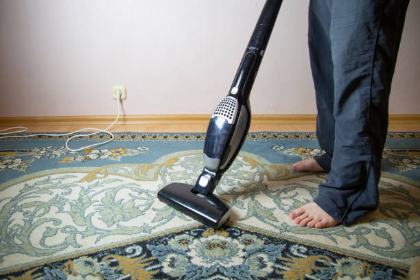 istock cleaning the floor with vacuum cleaner 1143318477