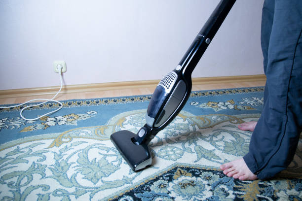 istock cleaning the floor with vacuum cleaner 1143318485
