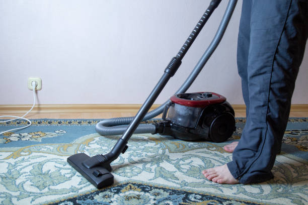istock cleaning the floor with vacuum cleaner 1143319045