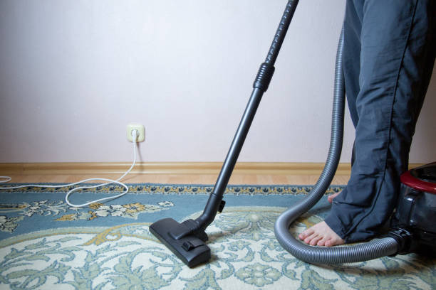 istock cleaning the floor with vacuum cleaner 1143319081