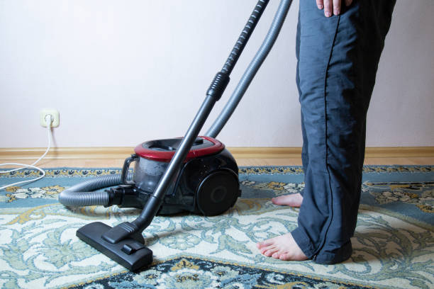 istock cleaning the floor with vacuum cleaner 1143319134