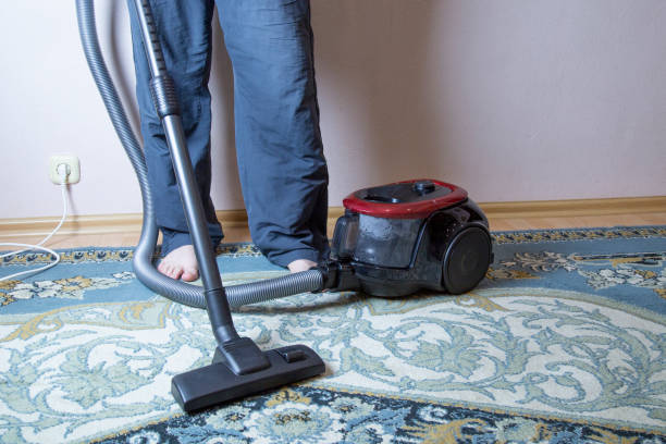 istock cleaning the floor with vacuum cleaner 1143319204