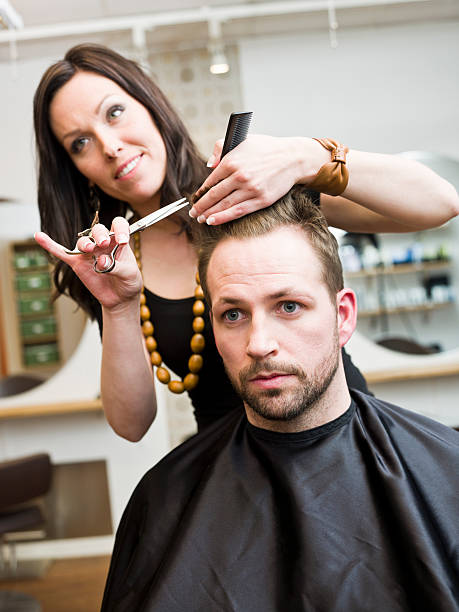 istock Man having his hair cut in a salon 114332025